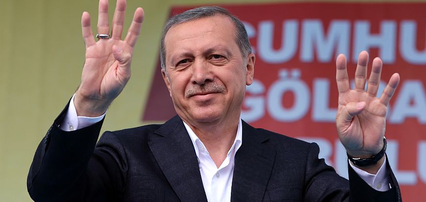 Turkey's President Recep Tayyip Erdogan salutes supporters as he addresses an election rally ahead of the upcoming June 7, 2015 general election in Golbasi, Ankara, Turkey, Friday, June 5, 2015. The overarching drama of the election has been whether Erdogan’s Justice and Development Party, or AKP, will win a strong enough majority to change the constitution and put Erdogan at the unquestioned pinnacle of Turkish politics in a new presidential system.(AP Photo/Burhan Ozbilici)